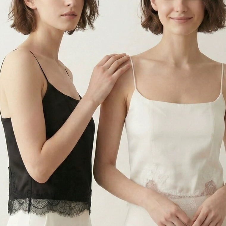 Two adult women wearing the ivory and black lace-hem silk camis