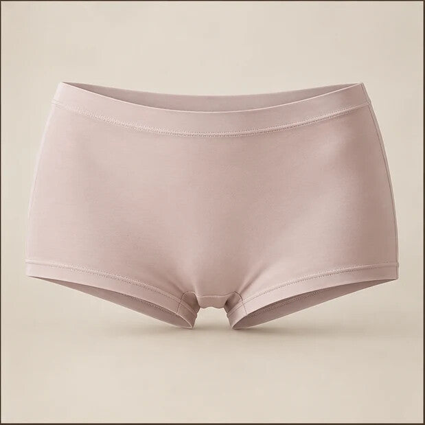Soft-stone seamless silk boyshort photographed on a warm neutral background