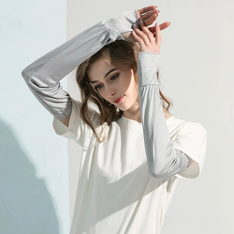 Adult woman wearing gray silk arm sleeves