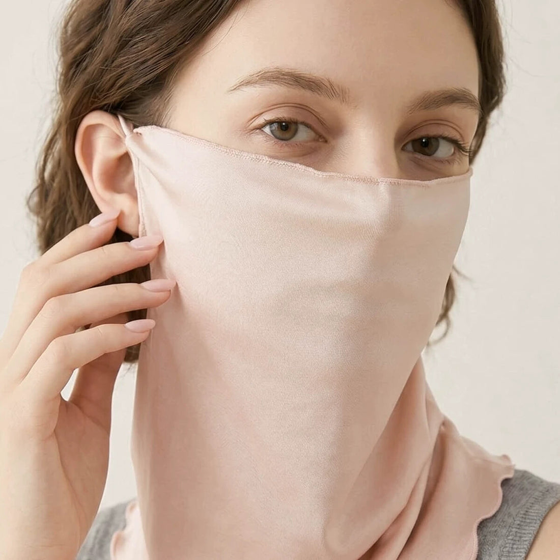 Adult woman wearing the nude silk face cover